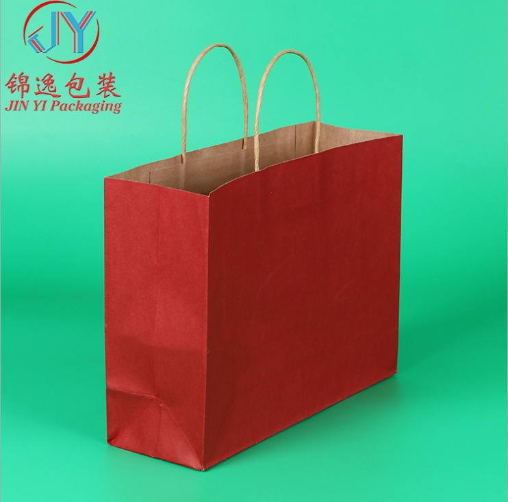 专业批发通用彩色牛皮纸袋 定做优质服装包装手提纸袋图片